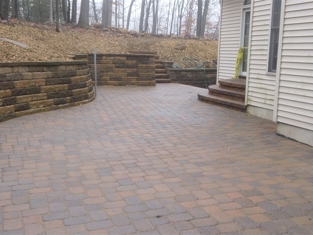 backyard patio with retaining wall